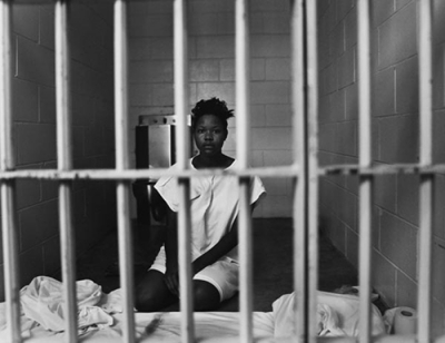 http://theindustrycosign.files.wordpress.com/2011/07/prison-woman.jpg